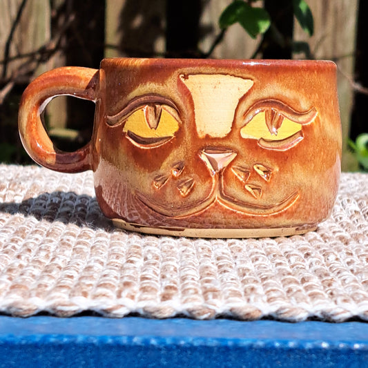 Teacup, 55, carved, golden luster, cat face